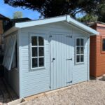 Breckland Heritage chalet Apex painted in Tranquil Blue with Georgian window upgrade and workbench