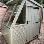 Malvern Potting shed 6 x 6 painted in Stone Green with Black fittings