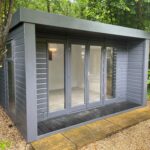 Malvern Studio Retreat 12 x 12 - 19mm HD Redwood - painted Graphite Grey - White White MDF - Dartmoor Oak Laminate